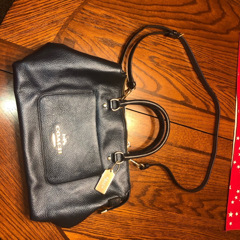 A beautiful navy blue coach purse!